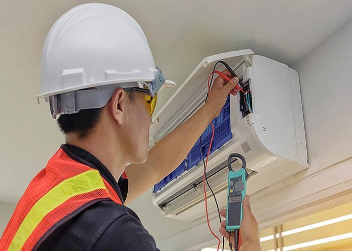 Technician is checking ducted air conditioning