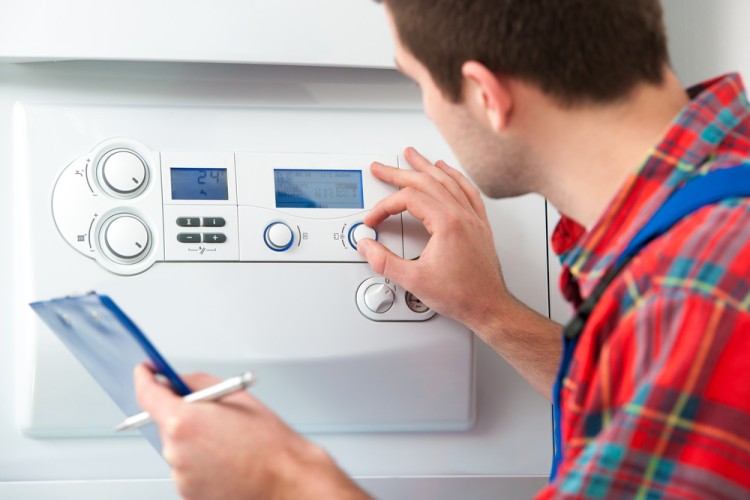 Technician Servicing Gas Boiler