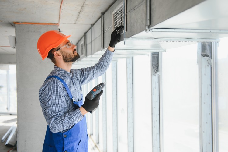 technician working on gas heater