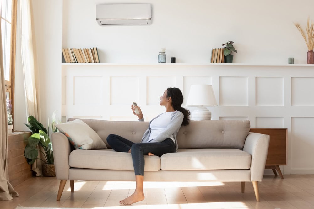 Woman turning on the AC